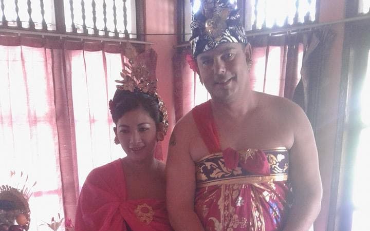 Ni Luh Srinasi and Marcel on their wedding day in 2014, next to Balinese offerings